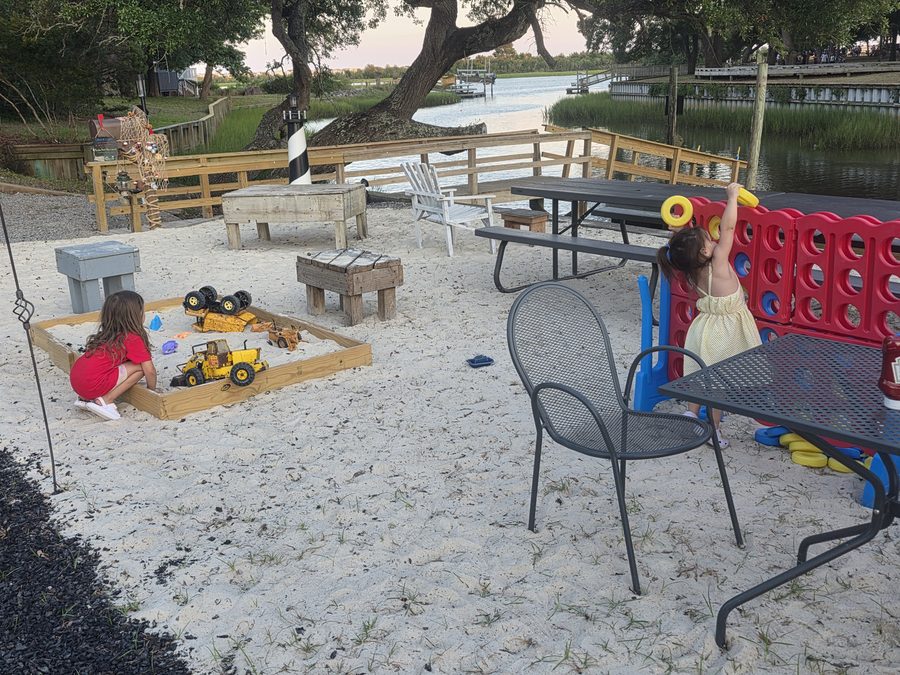Guests dining by the Intracoastal Waterway at Rustic Reel