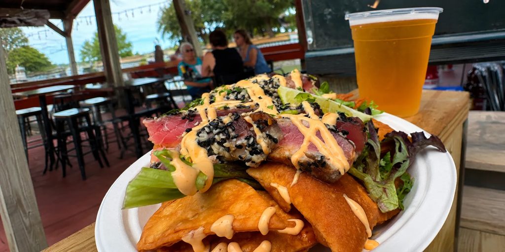 Food and a cold draft on the patio at Rustic Reel