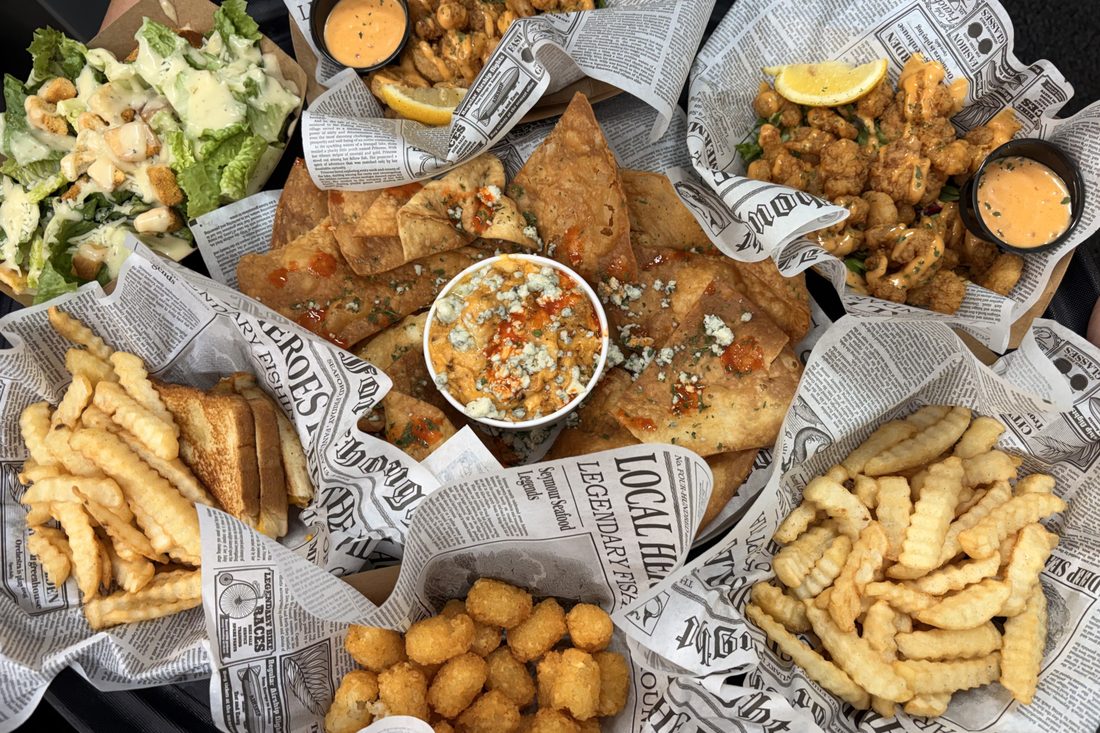 A spread of dishes on the table at Rustic Reel Bar & Grill